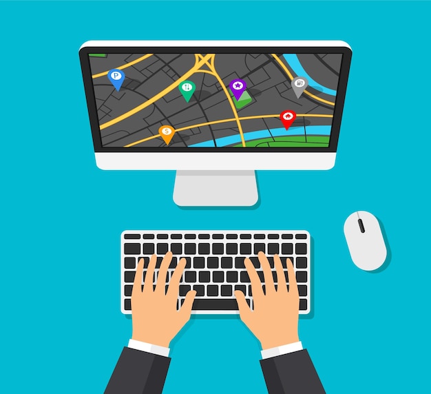 Computermonitor met kaartnavigatie op een scherm. gps-navigator met verschillende pinpoints. de mens typt op computertoetsenbord en maakt een route.