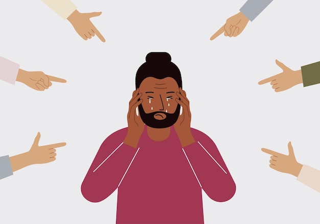 the concept of public condemnation victim blaming and bullying crying depressed man the fingers point at the character and hate him internet cyberbullying