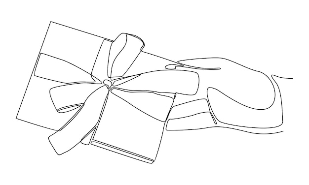 리본으로 묶인 크라프트 선물 상자를 들고 있는 연속적인 손
