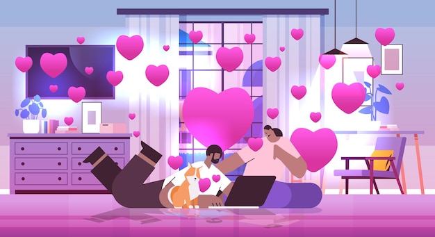 coupe verliefd op hond met behulp van laptop man vrouw viert Valentijnsdag woonkamer interieur met roze harten horizontaal