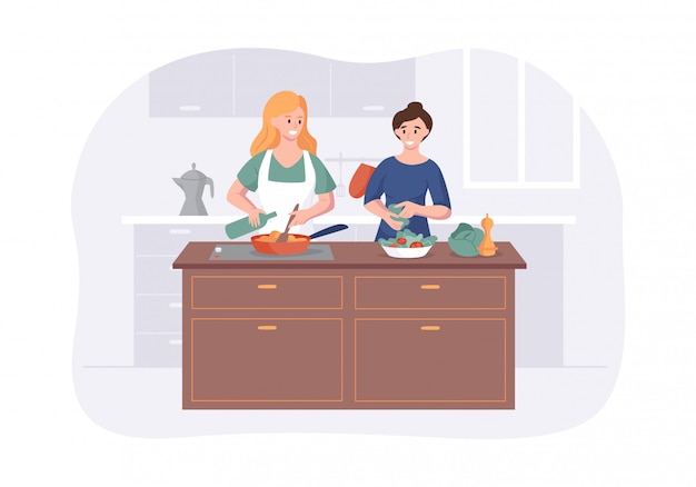 Couple girlfriends cooking on kitchen table. Two girls meal preparation for dining together.