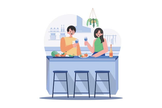 ワイングラスを手に持ったカップルがフルーツを持ってキッチンデスクに立っています