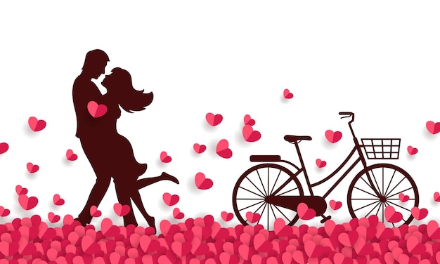Пара обнимается на поле бумажных сердец и катается на велосипеде.