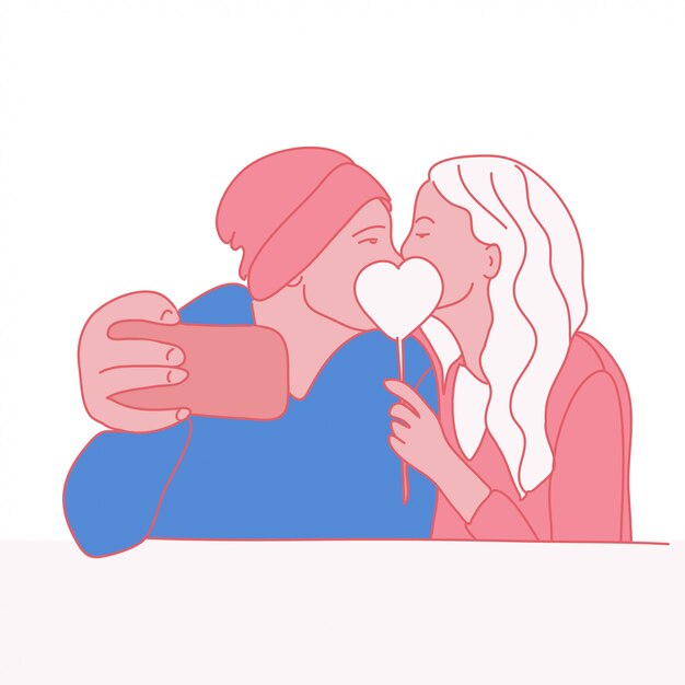 Couple in love kissing and taking a selfie.