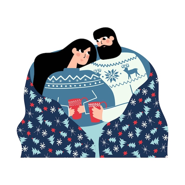 Пара в одинаковых свитерах сидит вместе с теплой чашкой под праздничным одеялом
