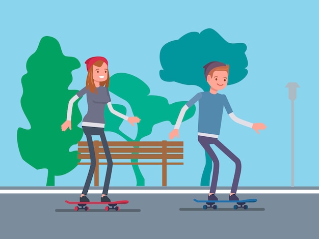 Пара играет скейтборд в парке