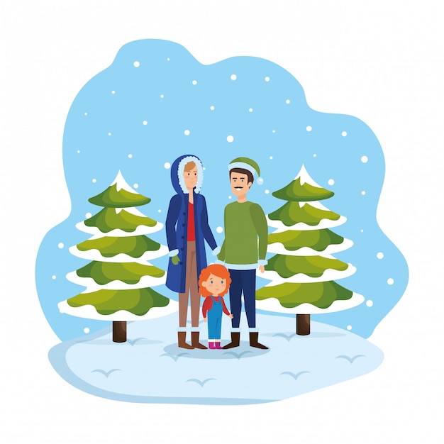 Couple with daughter with winter clothes in snowscape