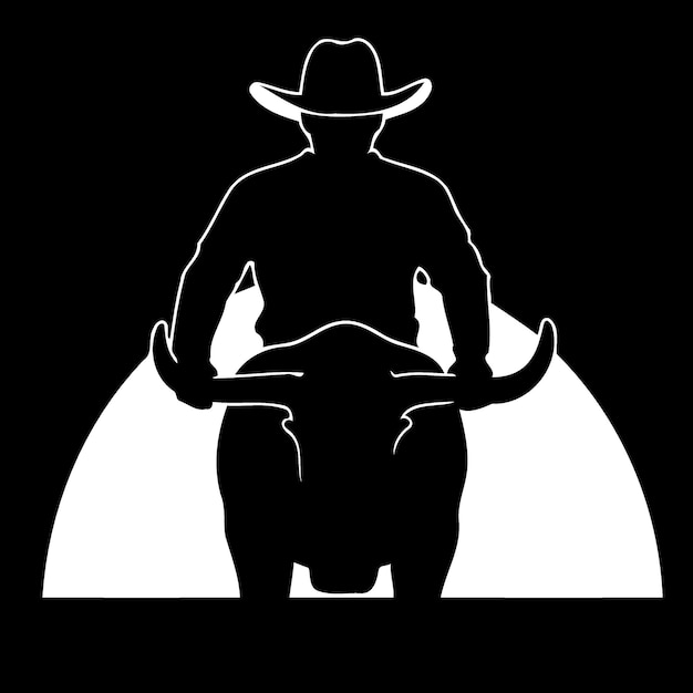 Uomo del cowboy che guida un toro