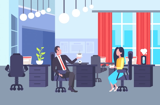 coworkers couple sitting at workplace colleagues discussing together during coffee break man woman business people talking office co-working center interior horizontal full length