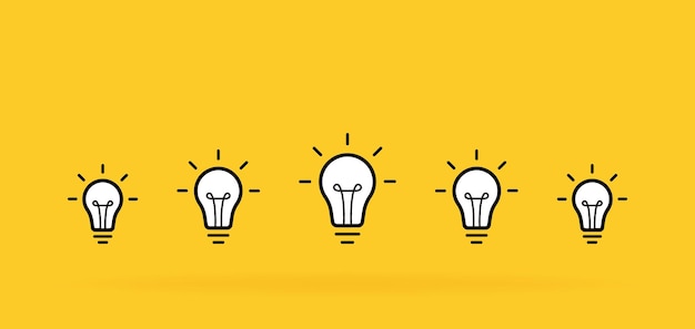 Vector creative idea set of standing light bulbs light with rays isolated on yellow background vector illustration