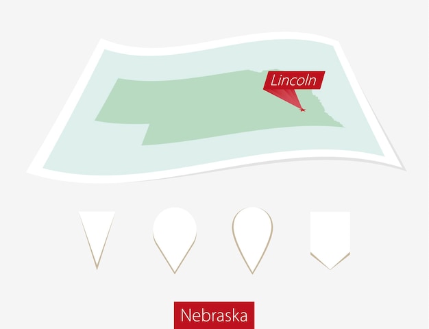 Curved paper map of Nebraska state with capital Lincoln