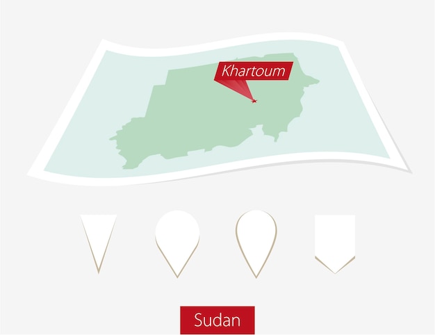 Vector curved paper map of sudan with capital khartoum on gray background