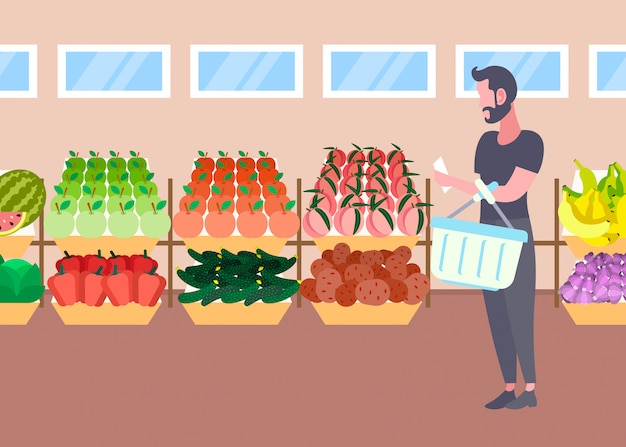 Vector customer man with basket buying fresh organic fruits vegetables modern supermarket shopping mall interior male cartoon character full length flat horizontal