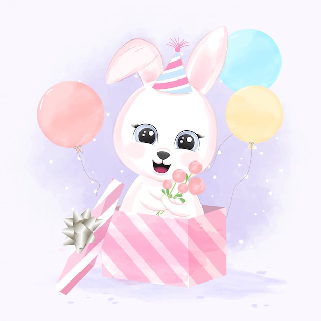 Simpatico coniglio bambino in confezione regalo e palloncini