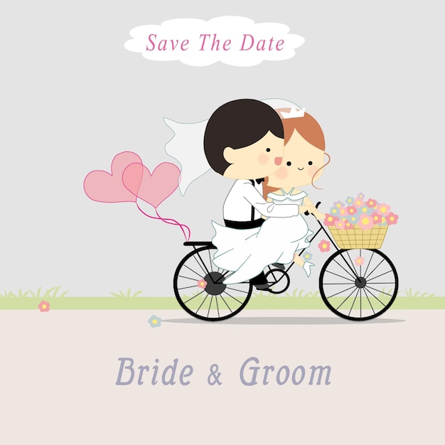 Cute bride and groom riding a bicycle