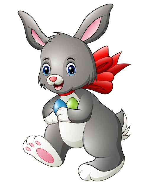 Симпатичный мультфильм кролик с двумя пасхальные яйца