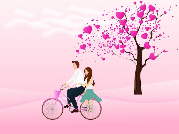 Cute couple riding bicycle and love tree on the background.