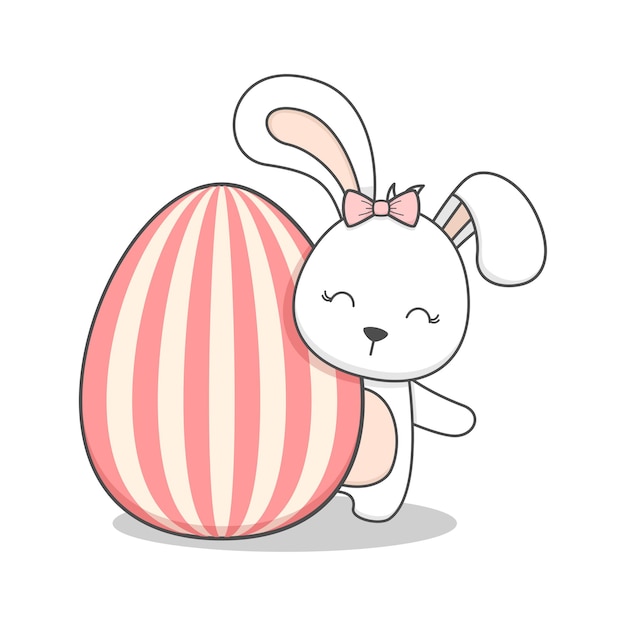 Cute easter bunny behind an egg