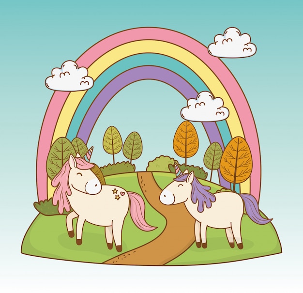 Unicorni da favola carino con arcobaleno nel paesaggio
