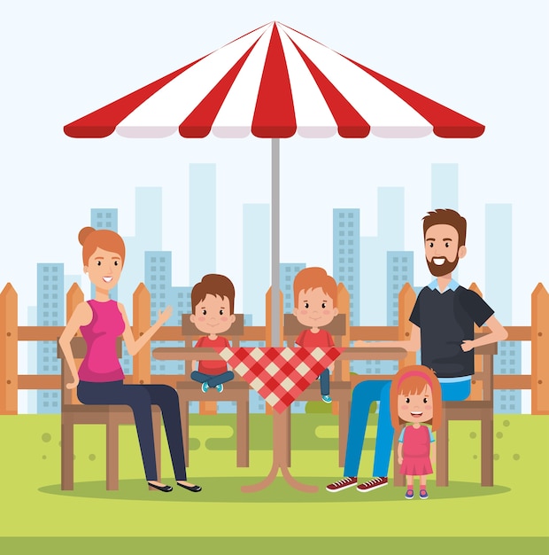Famiglia carina felice nei personaggi del giorno picnic