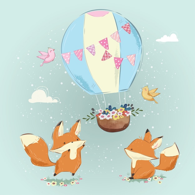 Милые лисы играют с воздушным шаром