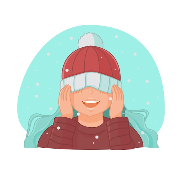 かわいい女の子は帽子をかぶって目を覆い、雪が降る中で喜ぶ