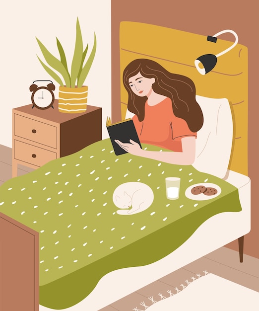 cute girl reading a book in bed before sleeping young woman in bedroom interior with cat