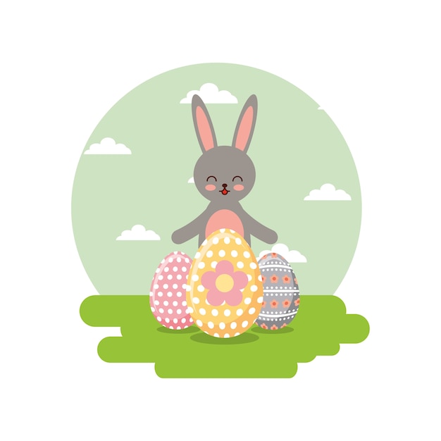 Cute gray rabbit and decorative eggs in landscape field