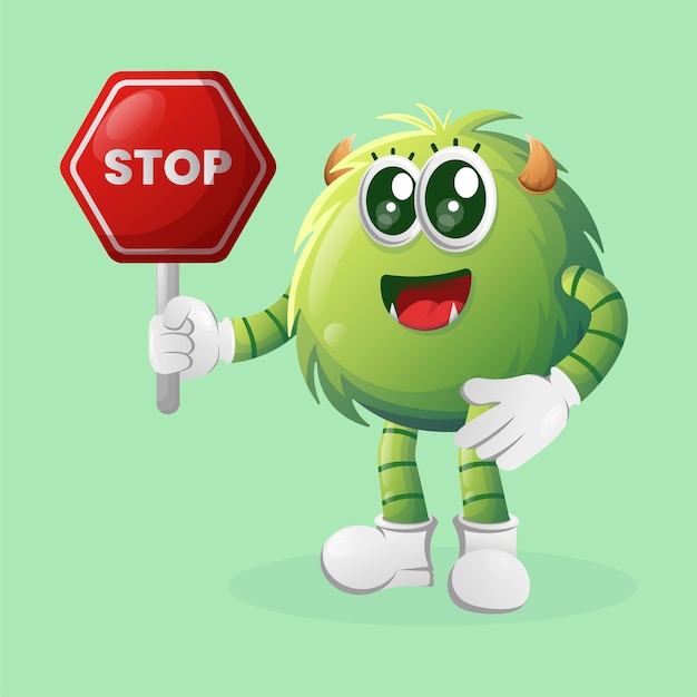 Cute green monster holding stop sign street sign road sign