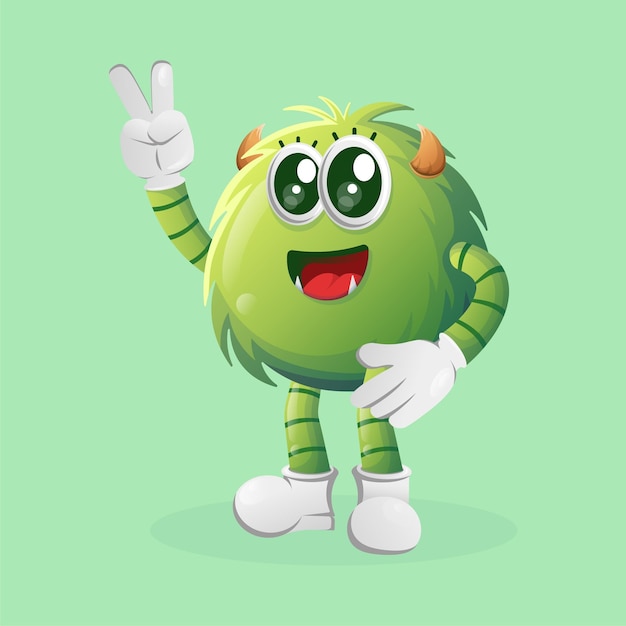 Cute green monster with peace hand