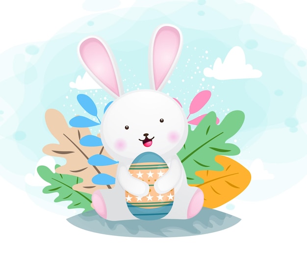 Милый счастливый улыбающийся кролик обнимает пасхальное яйцо