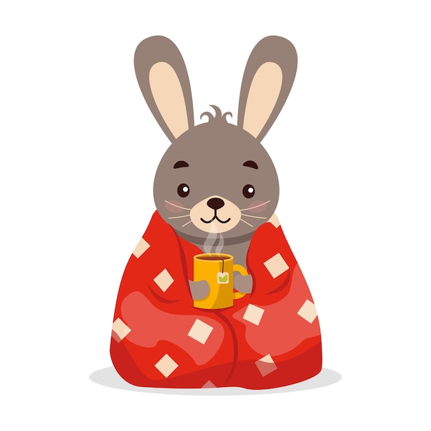 A cute hare (rabbit) wrapped in a blanket with hot tea.