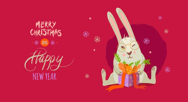 Милый заяц с подарочной коробкой и морковью с надписью "Счастливого Рождества и счастливого Нового года"