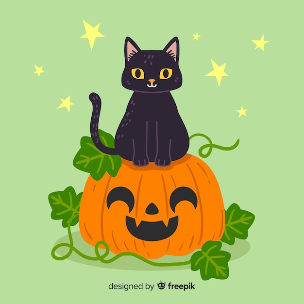 Vector cute kitten sitting on a pumpkin