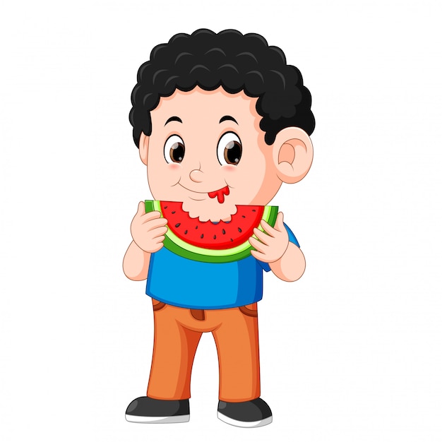 Cute little boy is eating watermelon