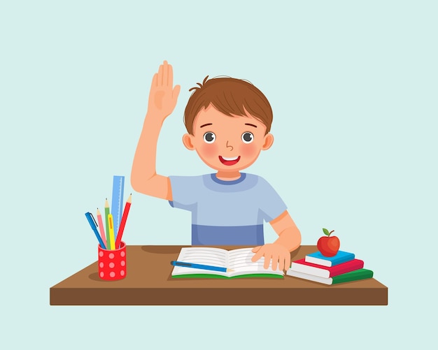 Cute little boy student rising hand asking question sitting at his desk in the classroom