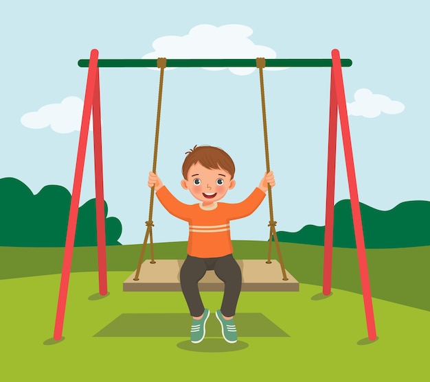 Cute little boy swinging and having fun on rope wooden swing in playground