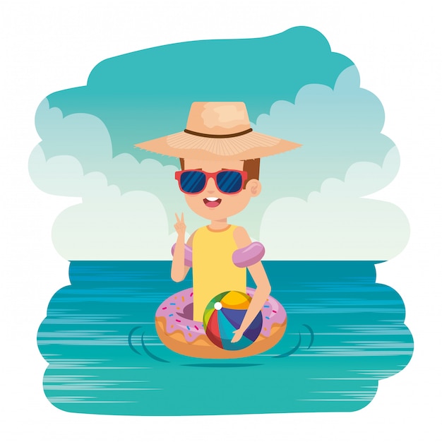 Cute little boy with donut float and beach balloon on the sea