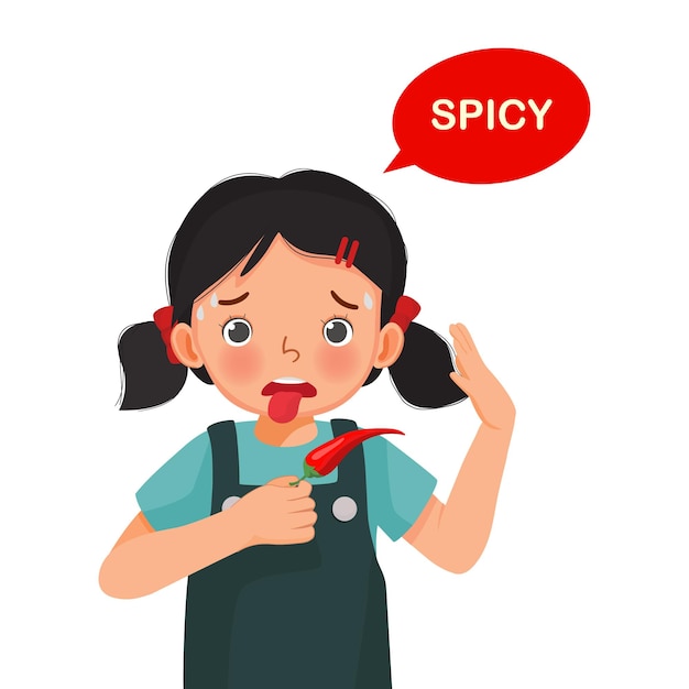 Bambina sveglia che tiene peperoncino rosso che mostra il gusto piccante della lingua cinque sensi