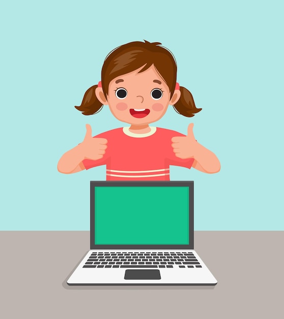 Cute little girl student standing behind desk laptop showing thumbs up