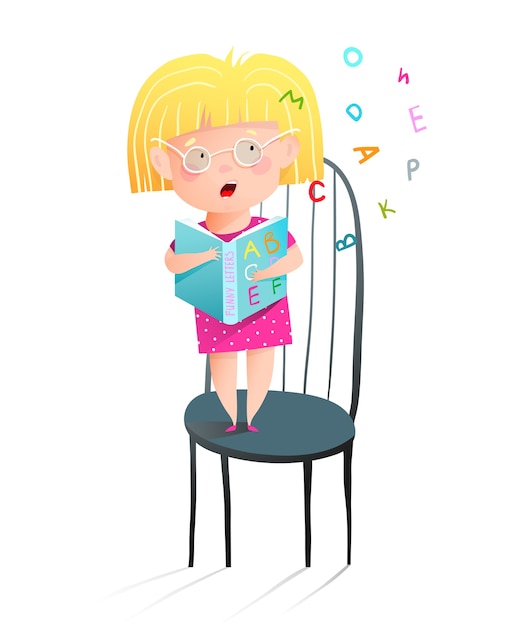 Cute little girl wearing glasses reading abc book aloud standing on chair