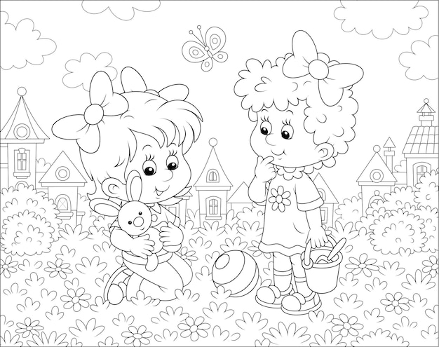 잔디밭의 꽃들 사이에서 작은 장난감 토끼를 가지고 노는 귀여운 소녀들