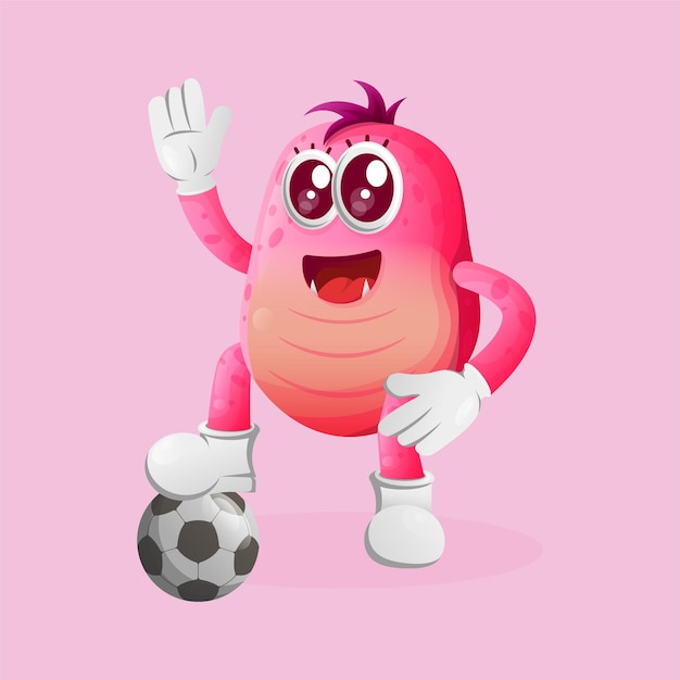 Cute pink monster play football soccer ball