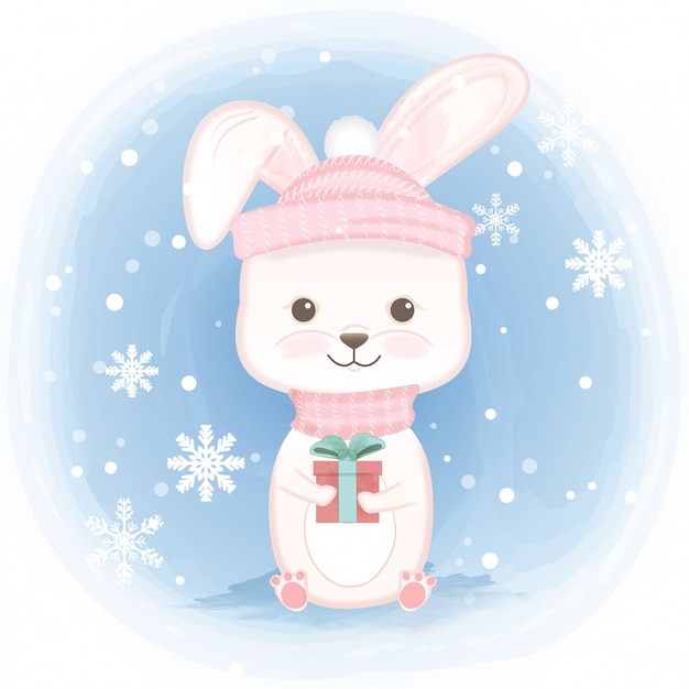 Cute rabbit holding gift box