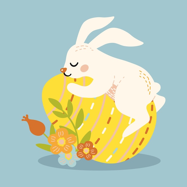 Cute rabbit lies on a big easter egg