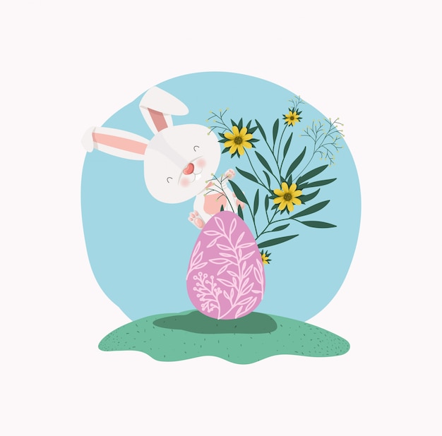Cute rabbit with egg painted and flowers in the garden