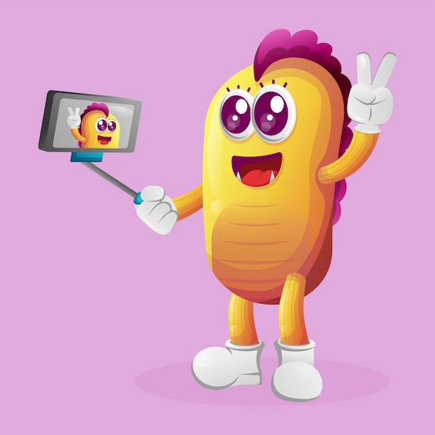 Cute yellow monster takes a selfie with smartphone