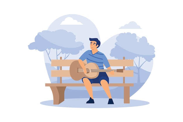 De jonge man zit op de bank en speelt akoestische gitaar in het park.
