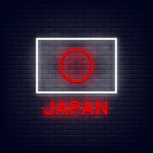 De vlag van japan van het neon bij bakstenen muur