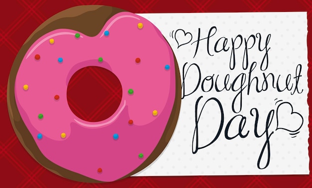 Delicious donut with heart shaped glaze on red napkin to celebrate Doughnut Day